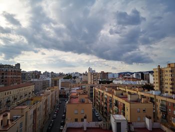 High angle view of buildings in city against sky