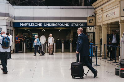 People walking on railroad station