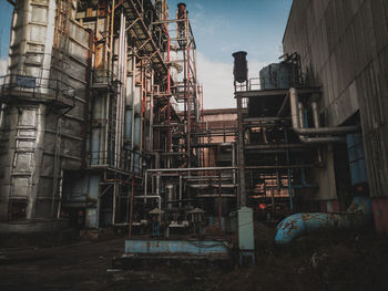 Low angle view of abandoned building against sky