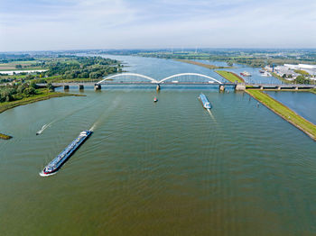 Bridge over river against sky