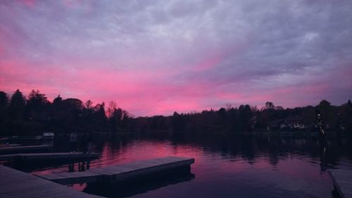 Scenic view of lake against sky at sunset