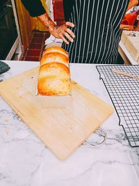 High angle view of person preparing food on cutting board