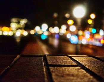 Defocused image of illuminated city at night