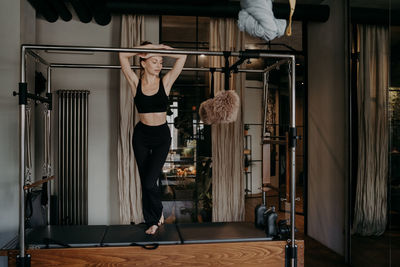 Woman exercising at health club