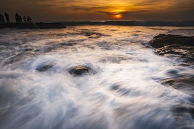 Scenic view of sea during sunset