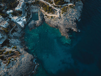 High angle view of rock formation in sea