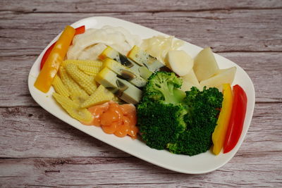 High angle view of fruits in plate on table