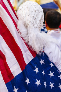 Rear view of person with american flag at event