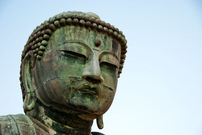 Low angle view of statue against clear sky