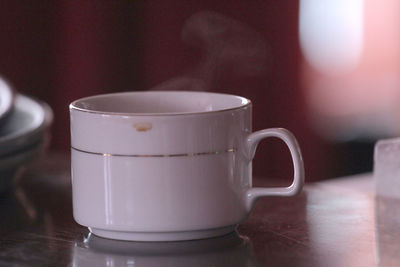 Close-up of coffee cup on table