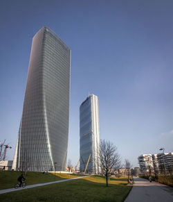 View of skyscrapers in city against clear sky