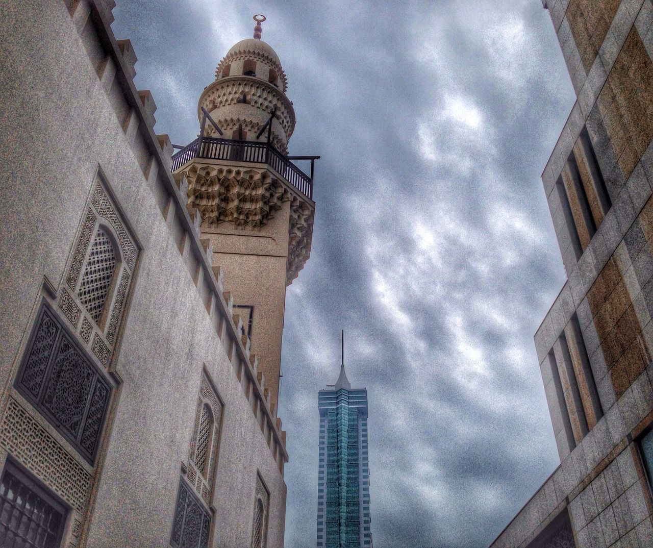 architecture, building exterior, built structure, low angle view, sky, cloud - sky, tower, city, famous place, religion, travel destinations, church, place of worship, cathedral, cloudy, tall - high, spirituality, capital cities, history