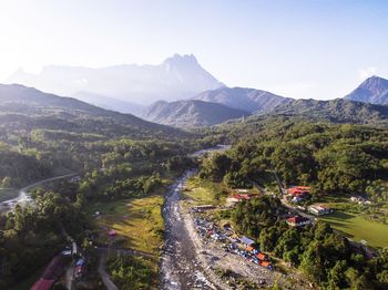 High angle view of road by mountains against sky