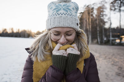 Portrait of a woman wrapped up warm whilst at the beach in sweden