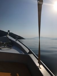 Close-up of nautical vessel on sea against clear sky