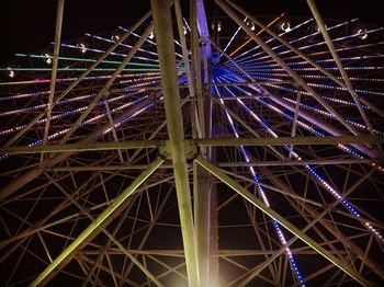 Low angle view of illuminated ferris wheel