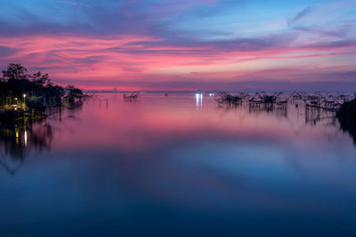 Scenic view of sea against romantic sky at sunrise