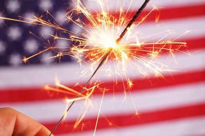 Low angle view of illuminated sparkler at night