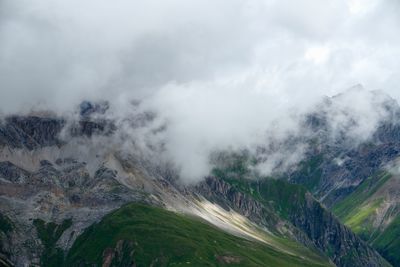 Scenic view of mountains in foggy weather