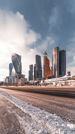 Buildings in city against sky