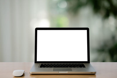 Close-up of laptop on table