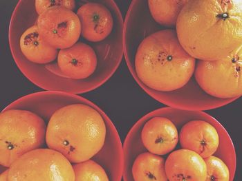 Directly above shot of oranges in baskets at market