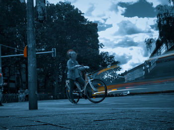 Man riding bicycle on street