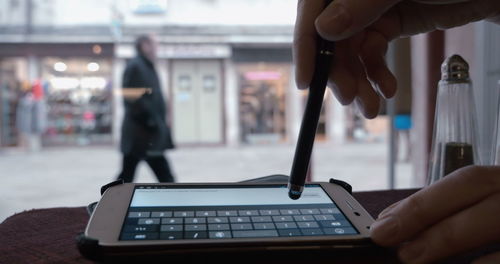 Close-up of person using mobile phone