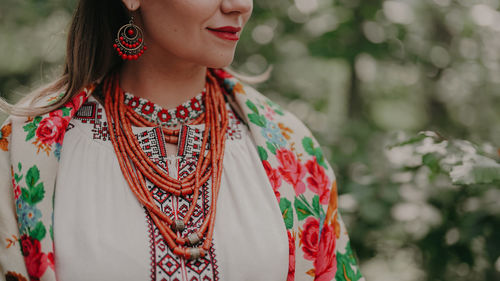 Portrait of young woman standing outdoors