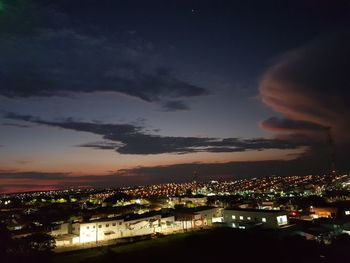 High angle view of illuminated buildings in city at night