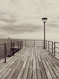 Pier over sea against sky