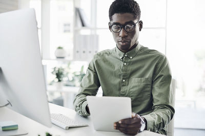 Portrait of man working on laptop