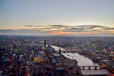 Aerial view of river and city during sunset