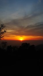 Scenic view of silhouette landscape against sky at sunset