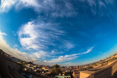 Low angle view of houses against blue sky