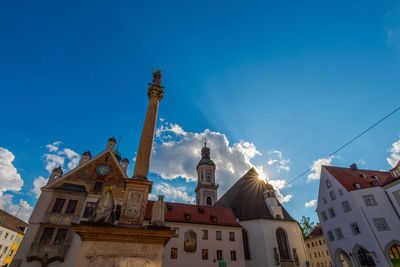 Low angle view of buildings against blue sky