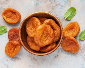 Dried apricots on a grey concrete background