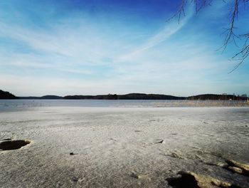 Scenic view of sea against blue sky