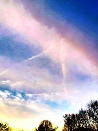 Low angle view of rainbow in sky