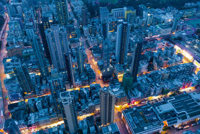 Aerial view of illuminated modern buildings in city