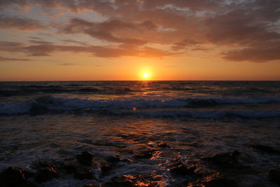 Scenic view of sea against sky during sunset