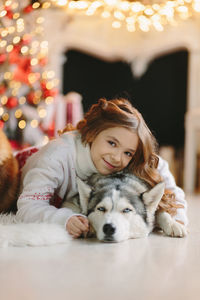 Portrait of young woman with dog