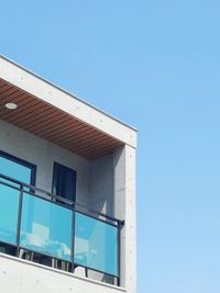 Low angle view of building against clear blue sky