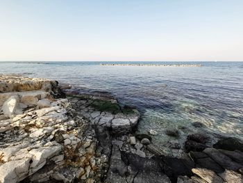 Scenic view of sea against clear sky