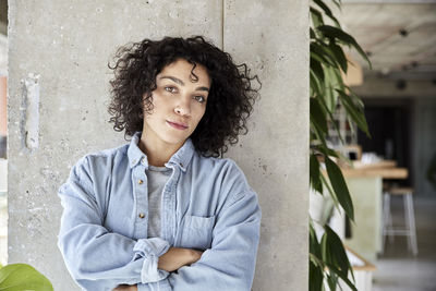 Portrait of a young woman sitting outdoors