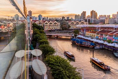 High angle view of river amidst buildings in city