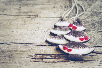 Close-up of chocolate christmas tree cookies on wooden table