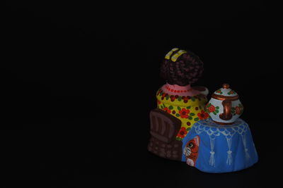 Close-up of toys against black background