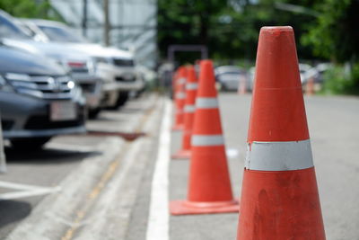 Traffic cones in row on sidewalk
