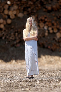 Rear view of woman wearing mask on field